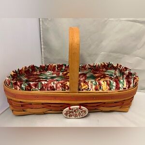 Longaberger Handwoven Basket with cloth and plastic liner.